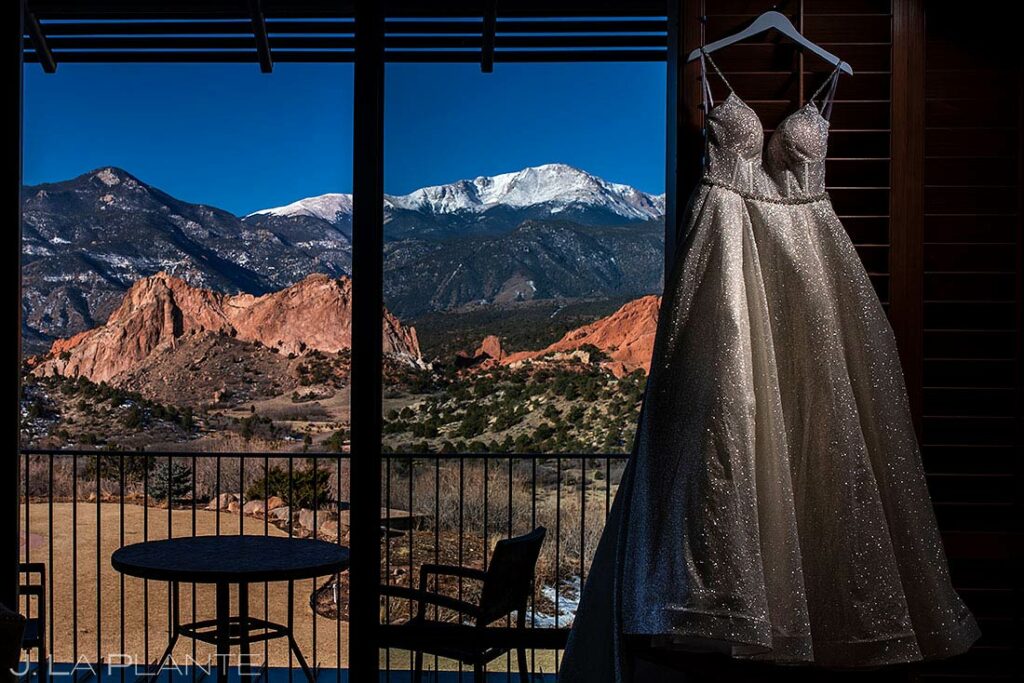 wedding dress hanging in the window