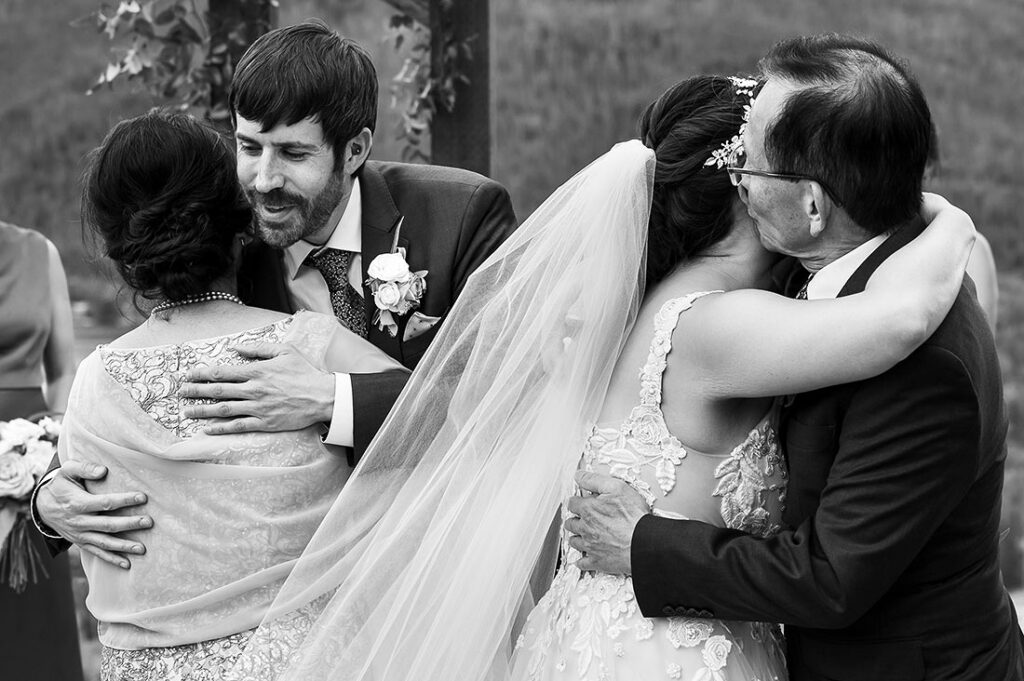 bride hugging her father before wedding ceremony