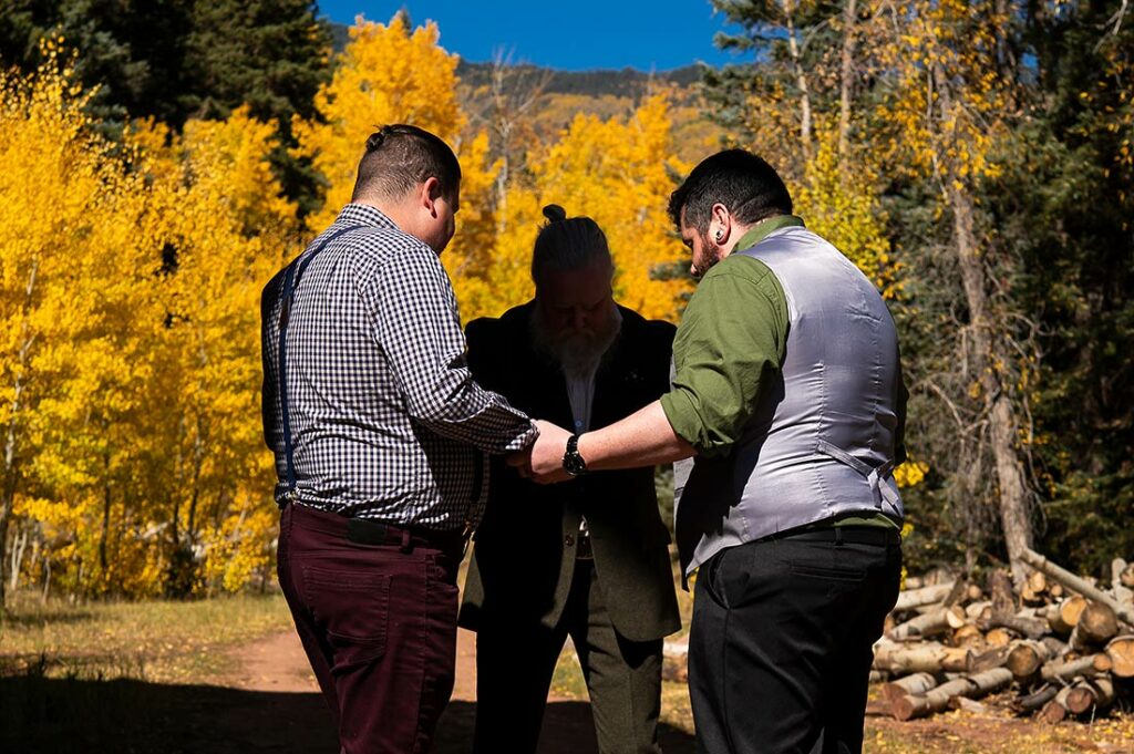 groom praying before Telluride elopement