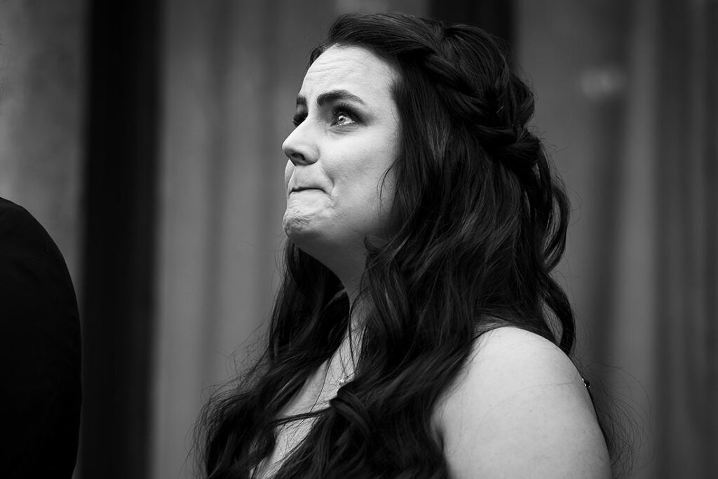 bridesmaid crying during wedding ceremony