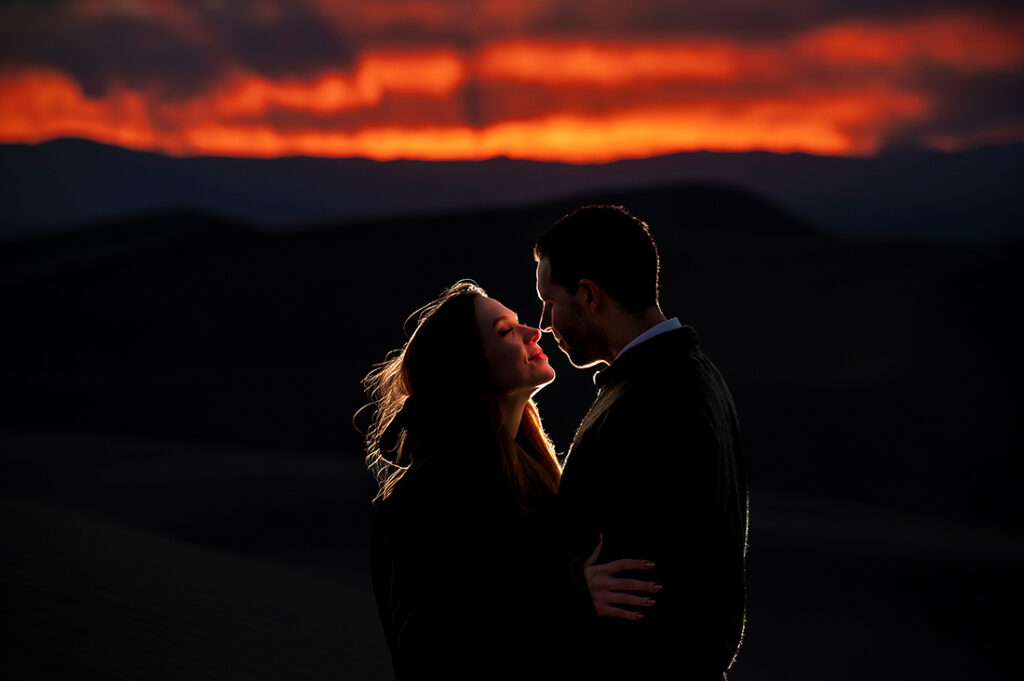 sunset portrait of bride and groom to-be at astrophotography engagement session