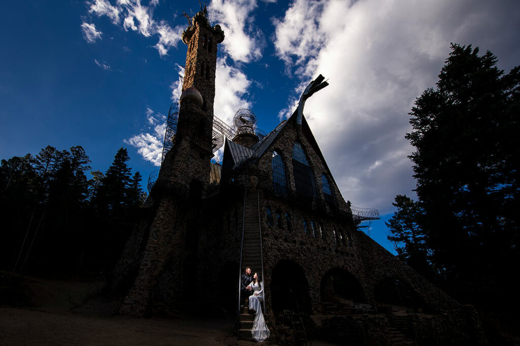 bride and groom at mountain castle