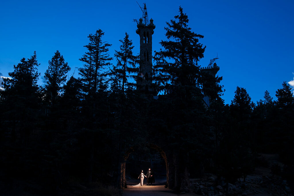 bride and groom at castle during blue hour