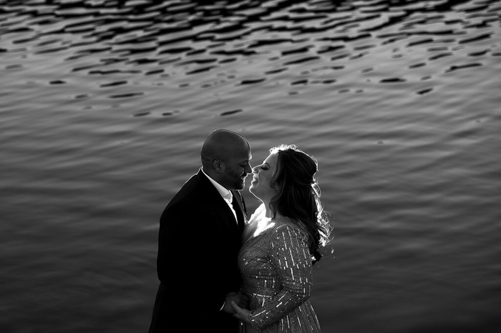 bride and groom to be by mountain lake during Pueblo engagement session