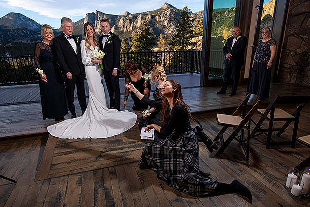 wedding photographer goofing around during family photos