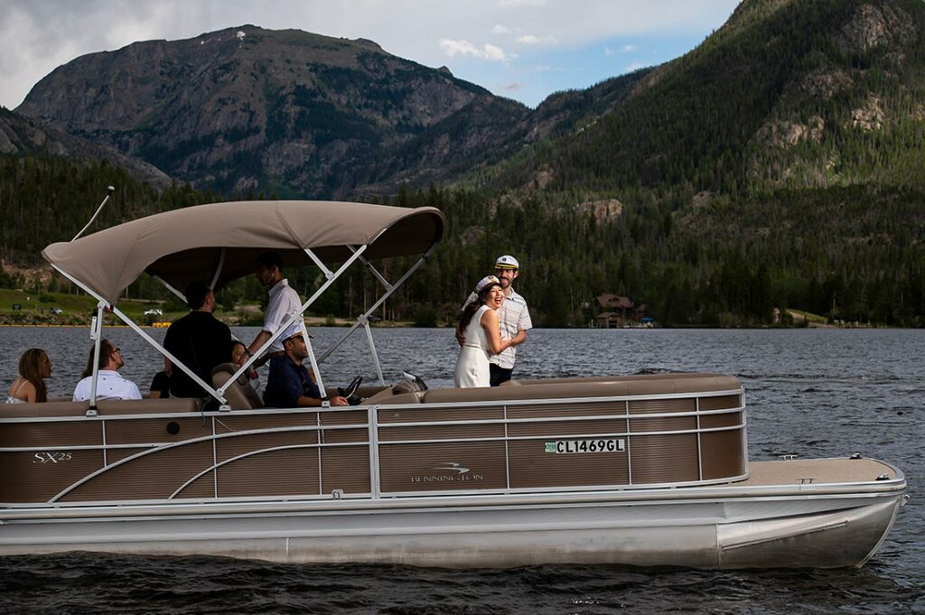 unique wedding welcome dinner ideas bride and groom on a pontoon boat