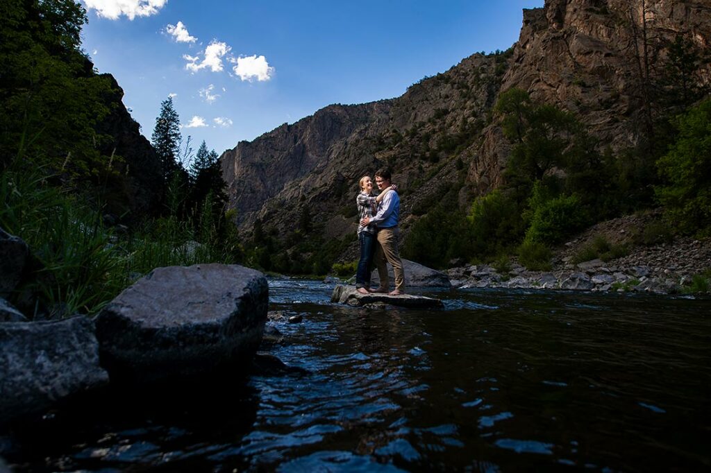 bride and groom-to-be in river at Black Canyon of the Gunnison engagement session