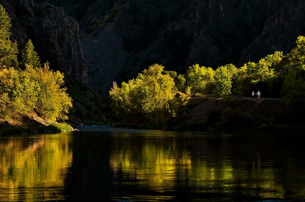 bride and groom-to-be with fall foliage at Black Canyon of the Gunnison engagement session