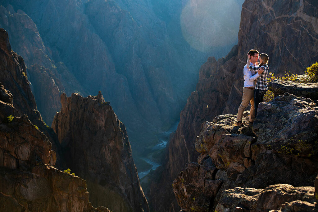 bride and groom-to-be on cliff at Black Canyon of the Gunnison engagement session