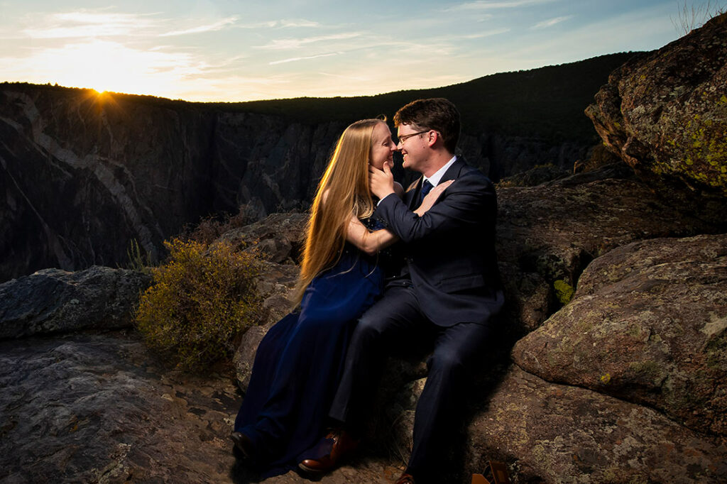 bride and groom-to-be kissing during sunset at Black Canyon of the Gunnison engagement session