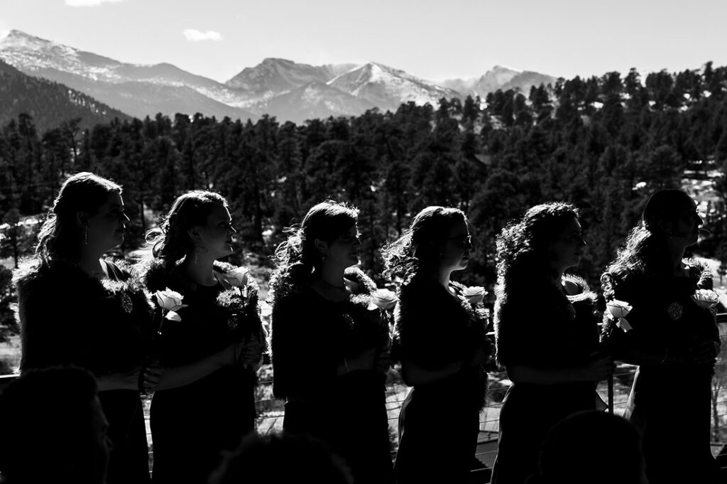 SkyView wedding at Fall River Village bridesmaids at windy wedding ceremony