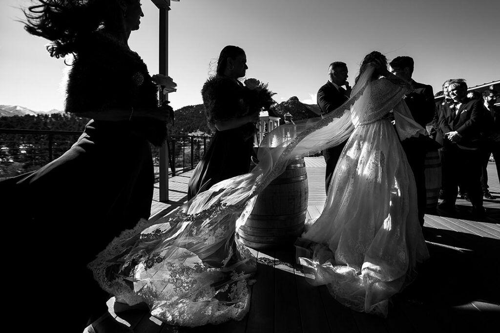 SkyView wedding at Fall River Village bride's veil blowing in the wind during ceremony
