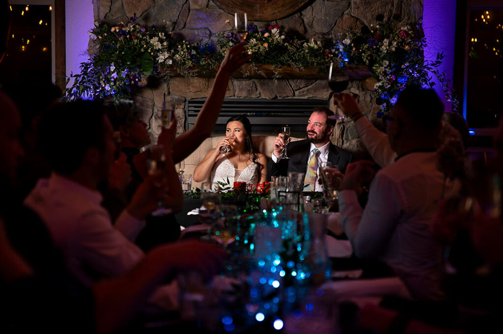 Taharaa Mountain Lodge wedding bride and groom toasts