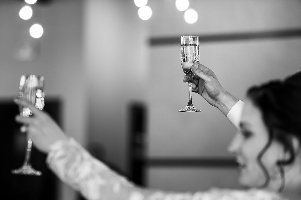 bride and groom toasting with champagne glasses