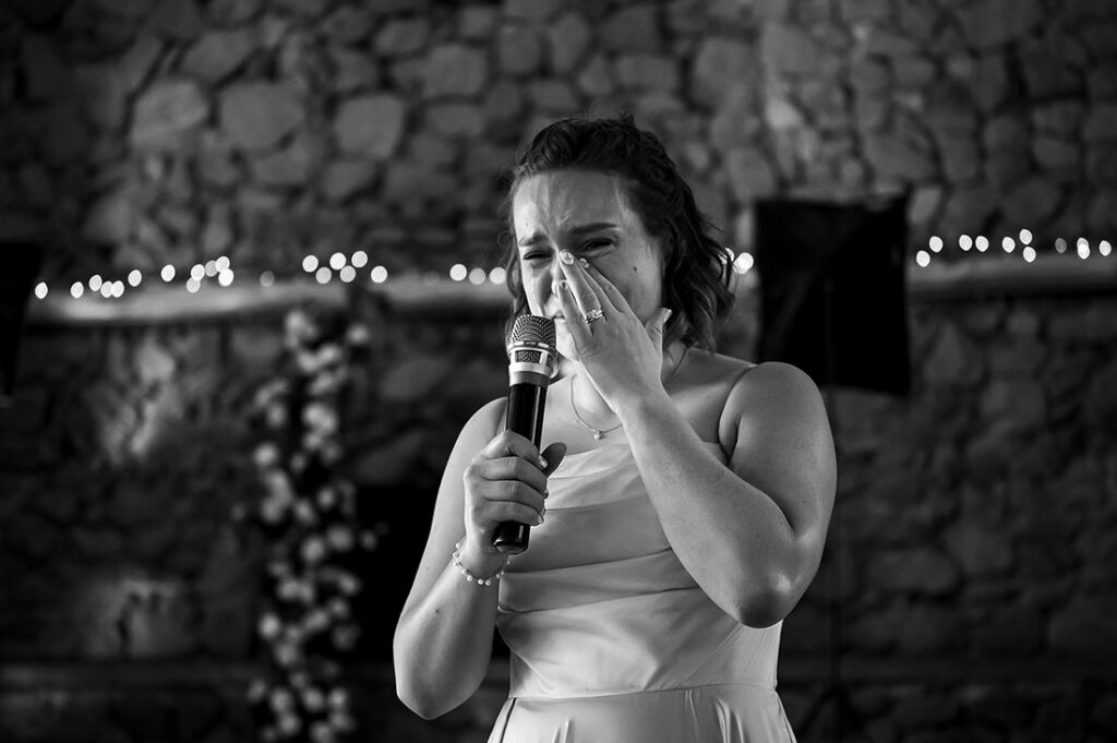bride crying during toast at Pinecrest wedding in Colorado Springs