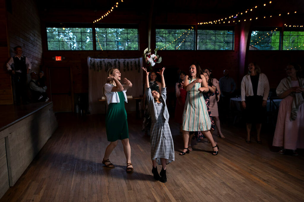 bouquet toss at Pinecrest wedding in Colorado Springs